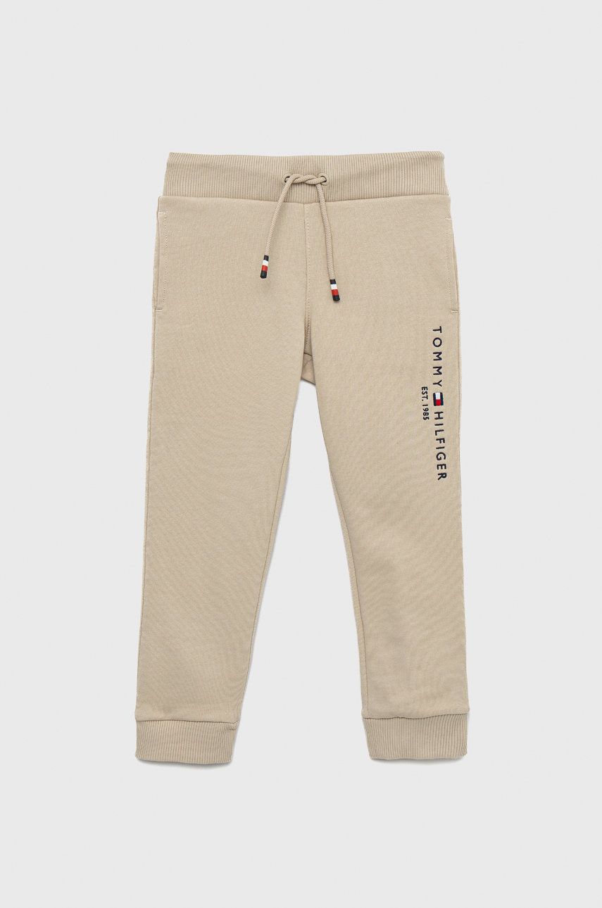 Tommy Hilfiger spodnie dresowe bawełniane dziecięce kolor beżowy gładkie