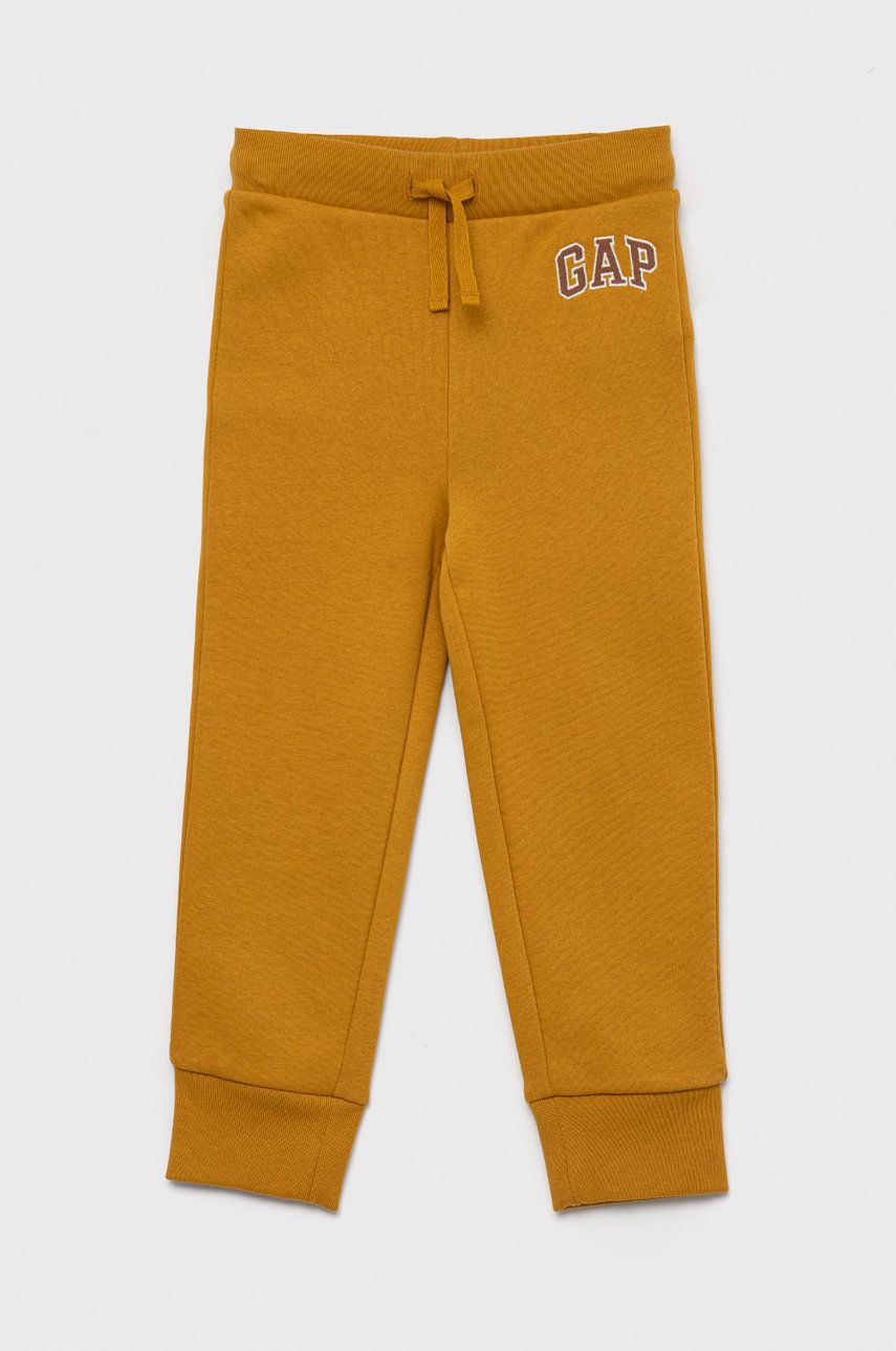 GAP spodnie dresowe dziecięce kolor żółty gładkie