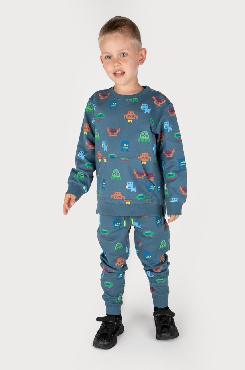 Дитячі бавовняні штани Coccodrillo колір синій візерунок Дитячі бавовняні штани Coccodrillo колір синій візерунок