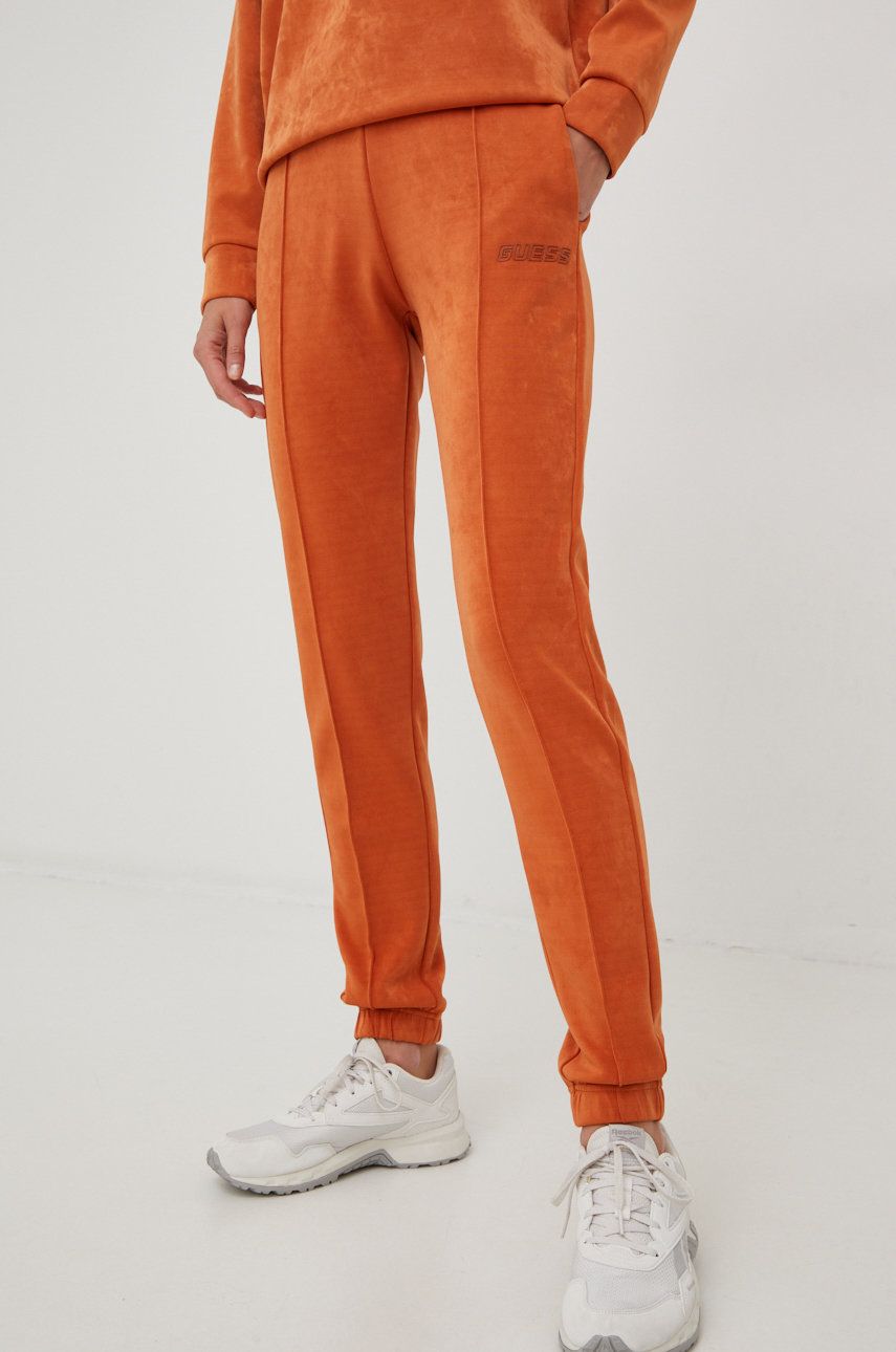 Tepláky Guess dámské, oranžová barva, s aplikací - oranžová -  84% Polyester