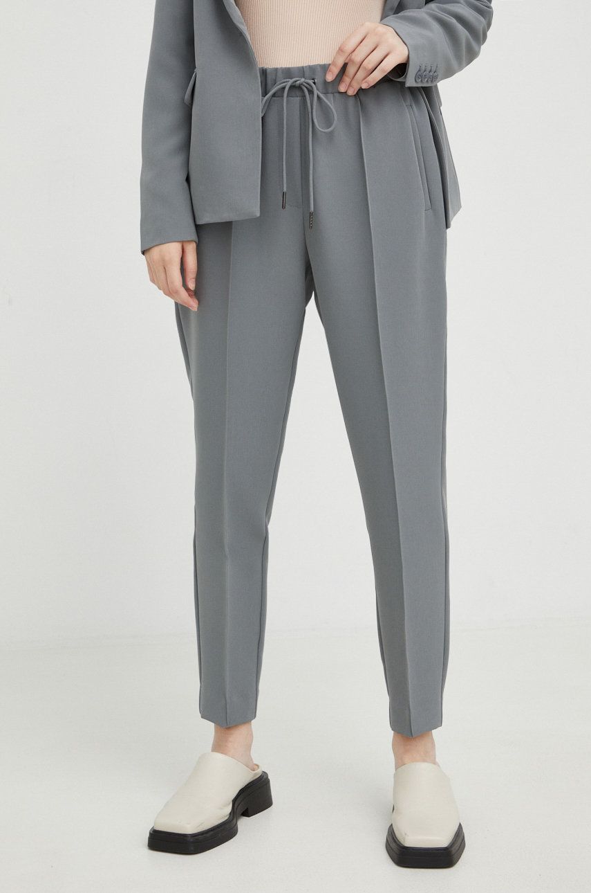 Levně Kalhoty Bruuns Bazaar dámské, šedá barva, přiléhavé, high waist
