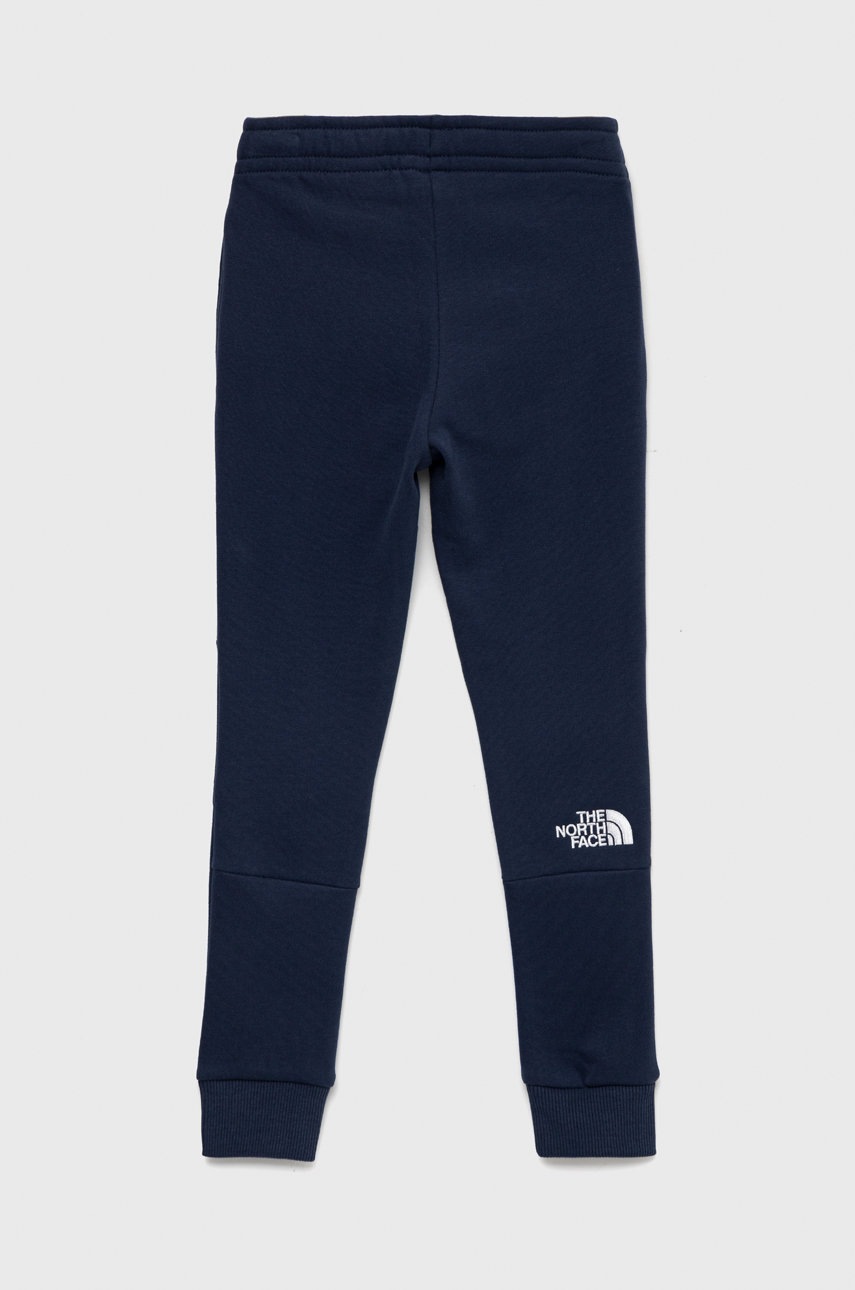 

Дитячі бавовняні штани The North Face колір синій однотонні