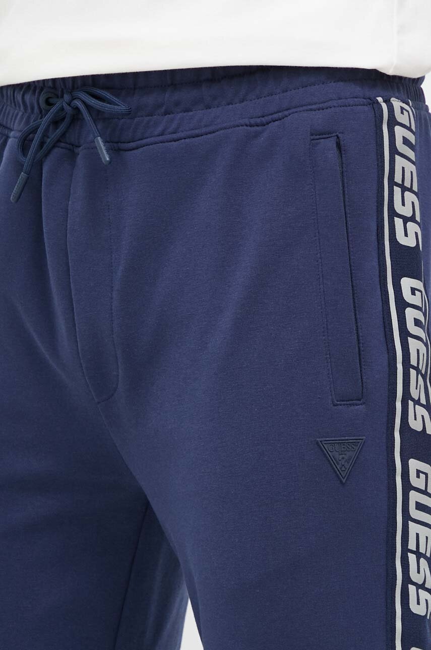 Спортивні штани Guess колір синій з принтом 