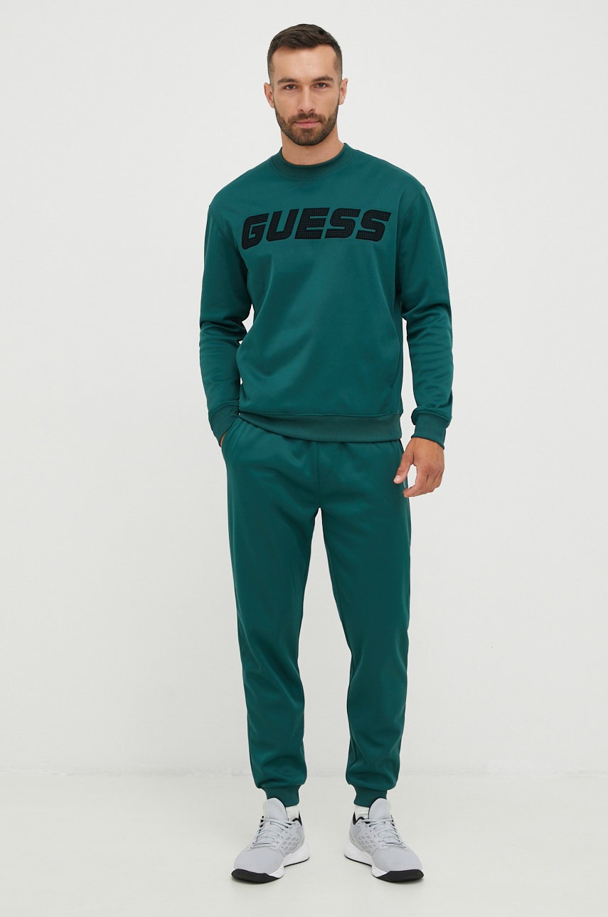 

Спортивні штани Guess чоловічі колір зелений однотонні