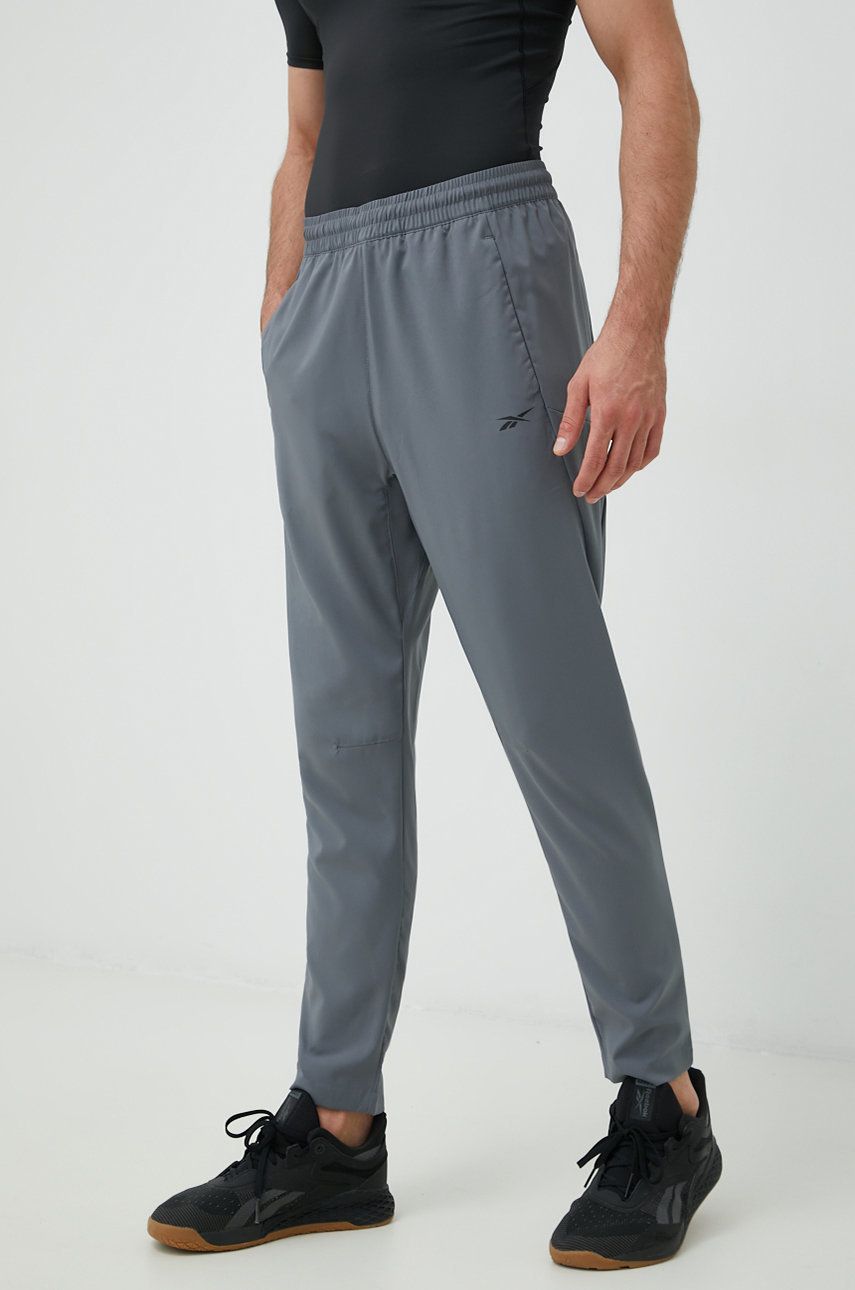 Levně Tréninkové kalhoty Reebok Workout Ready pánské, šedá barva, hladké