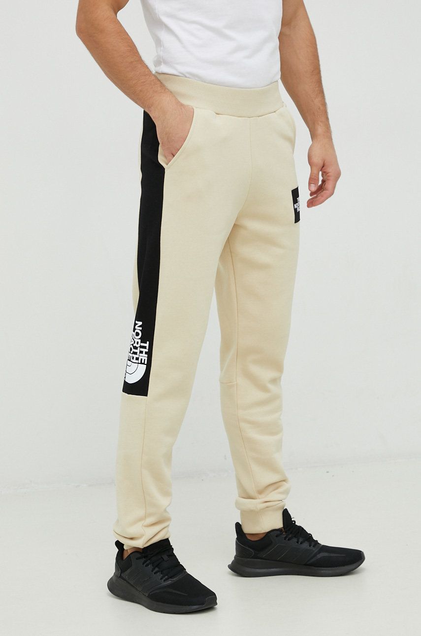 The North Face pantaloni de trening din bumbac barbati, culoarea bej, modelator