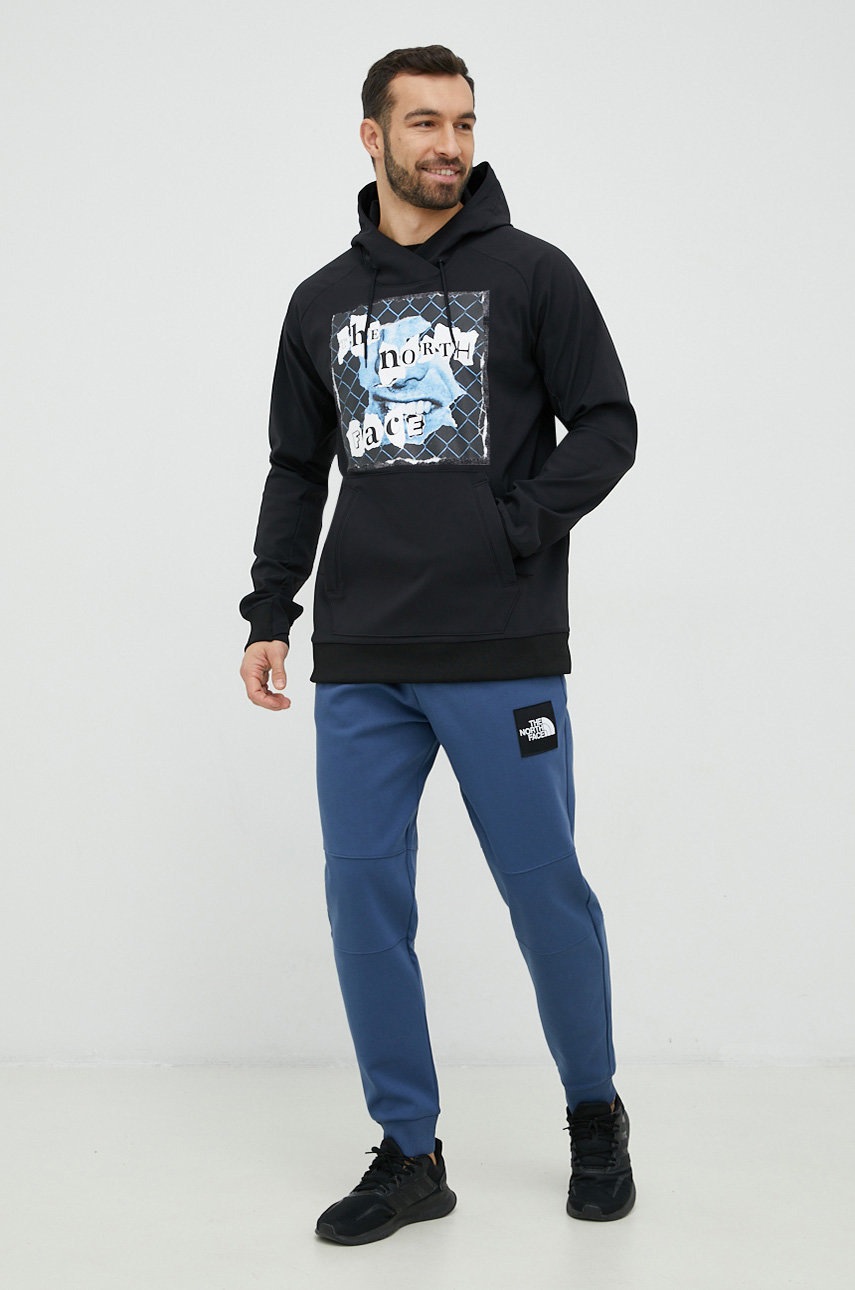 

Бавовняні спортивні штани The North Face чоловічі колір синій однотонні