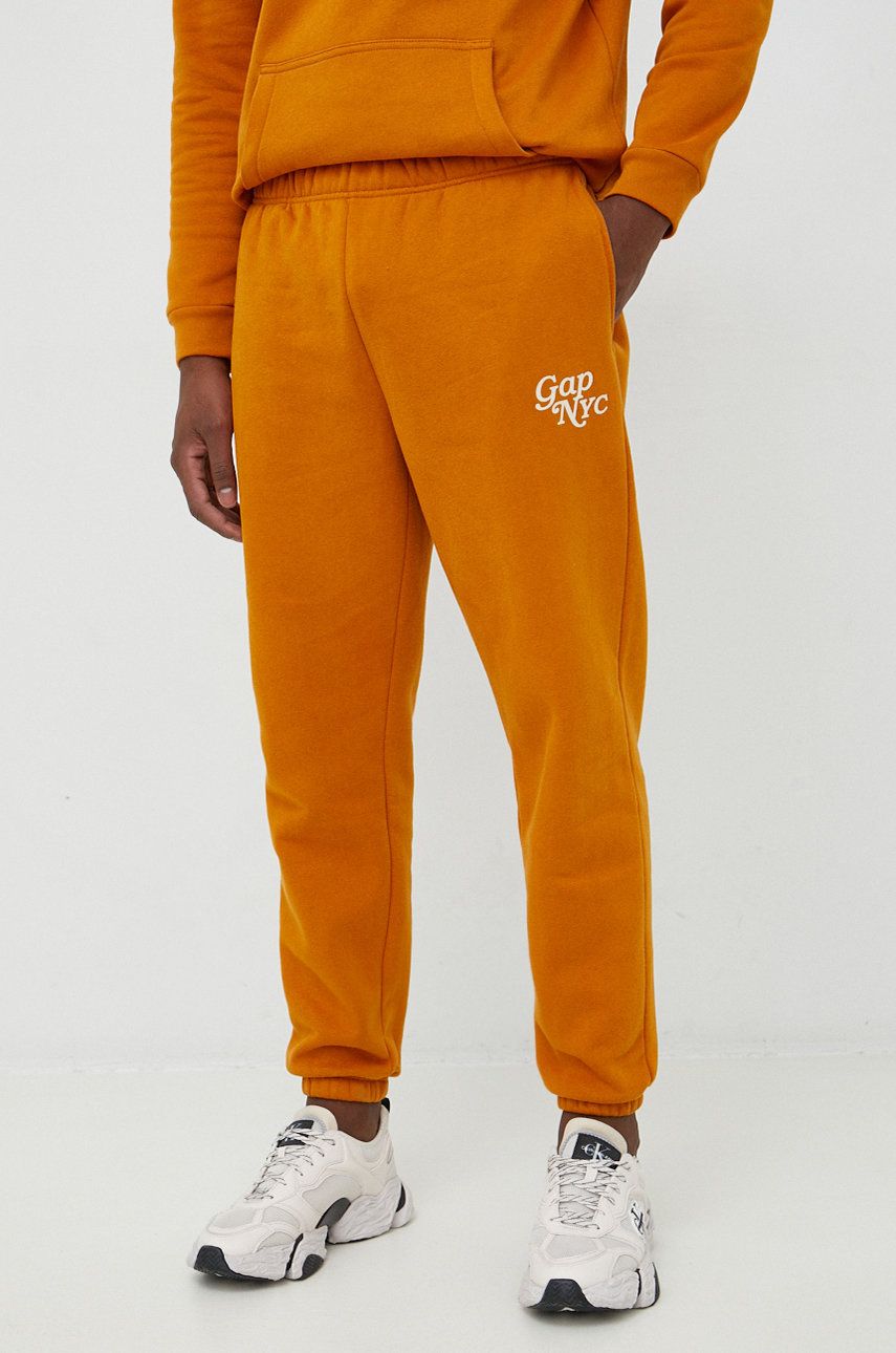 GAP pantaloni de trening barbati, culoarea portocaliu, cu imprimeu