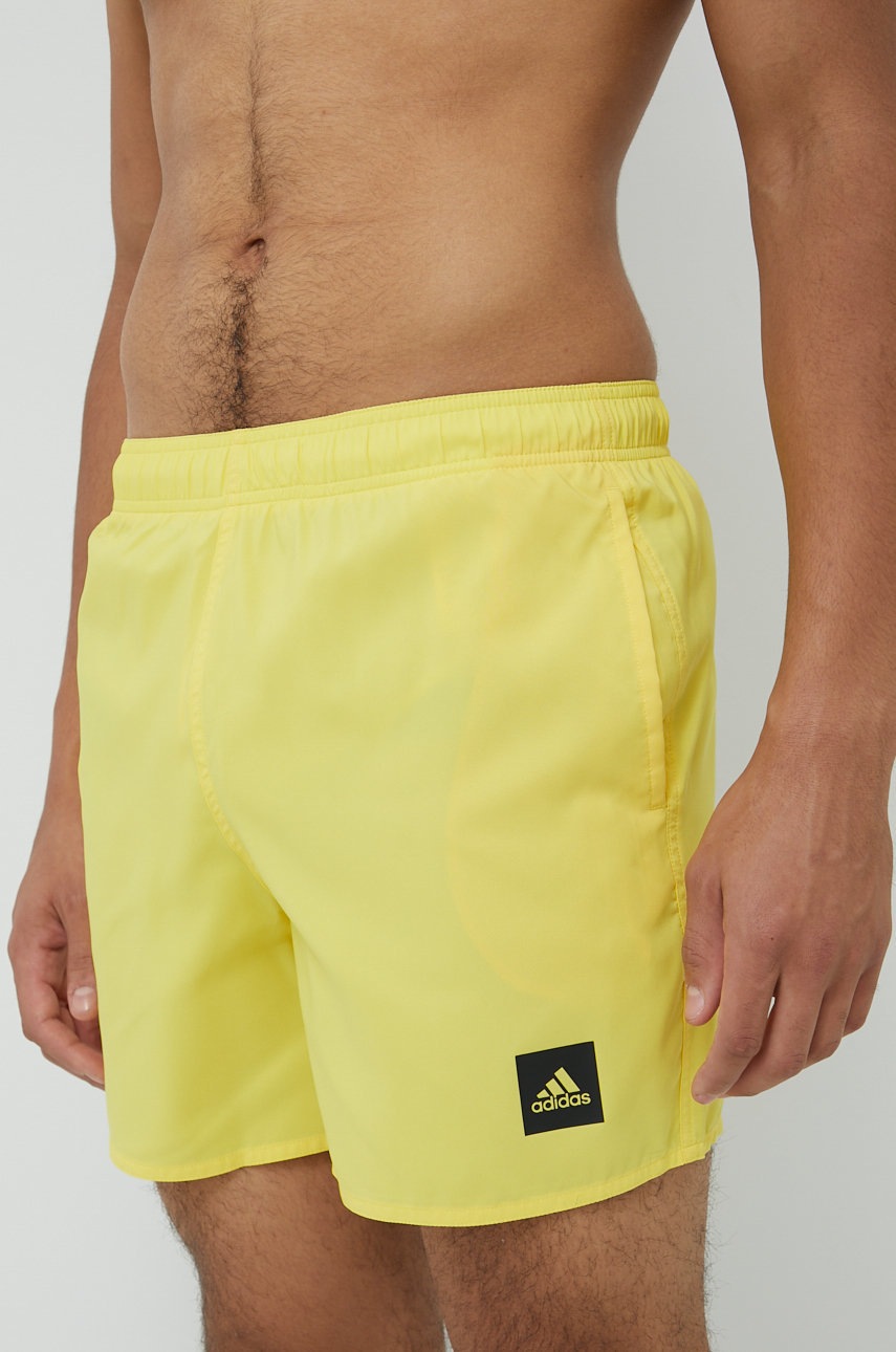 

Купальні шорти adidas Performance Solid чоловічі колір жовтий однотонні