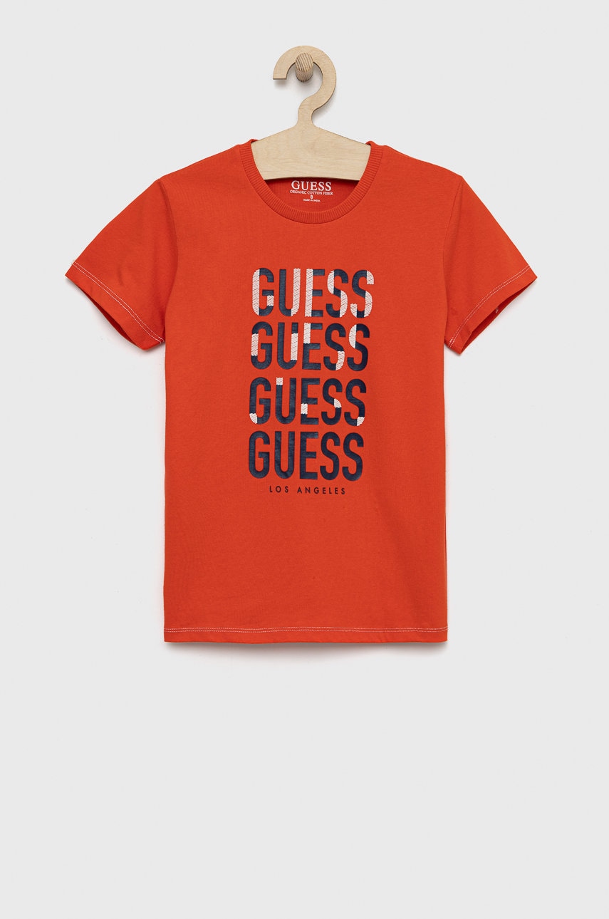 

Дитяча бавовняна футболка Guess колір помаранчевий з принтом