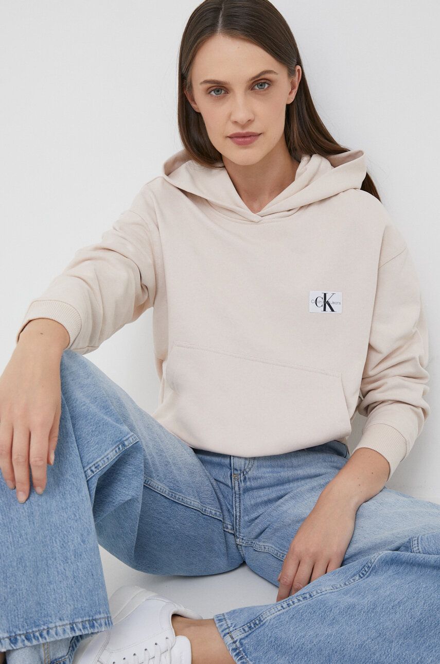 Bavlněná mikina Calvin Klein Jeans dámská, béžová barva, s kapucí, s aplikací - béžová - 100 % Bavln