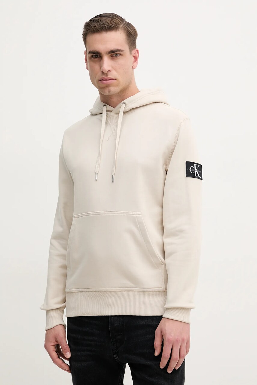 Levně Bavlněná mikina Calvin Klein Jeans pánská, béžová barva, s kapucí, s aplikací, J30J323430