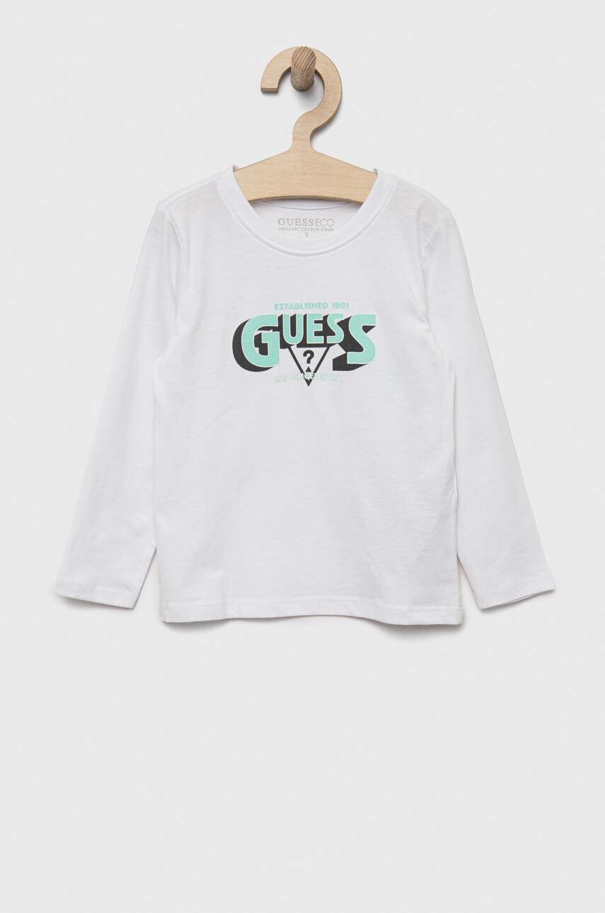 

Дитячий бавовняний лонгслів Guess колір білий з принтом
