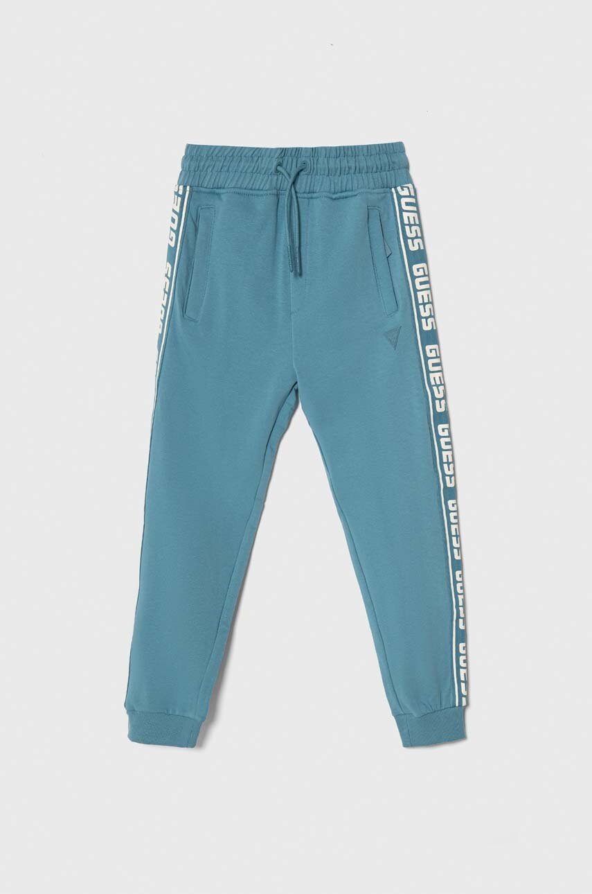 

Дитячі спортивні штани Guess з принтом