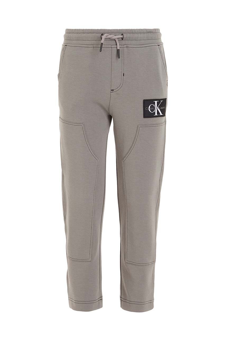 Дитячі спортивні штани Calvin Klein Jeans колір сірий однотонні