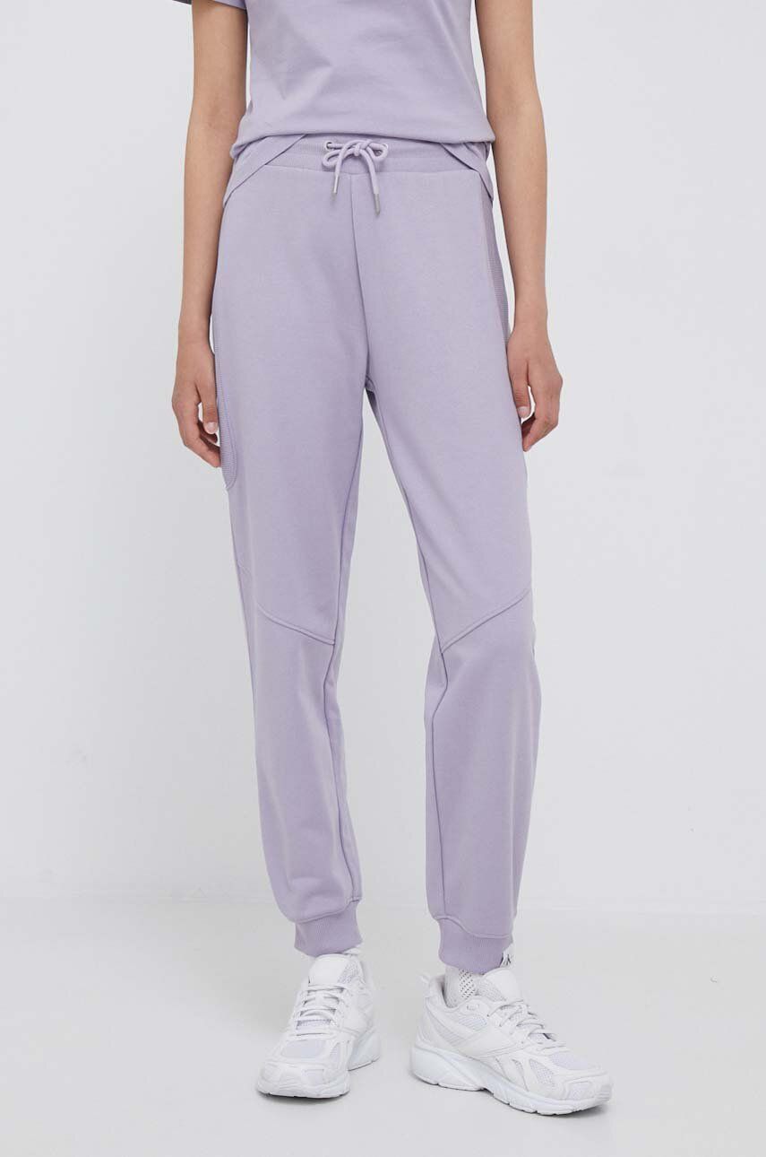Tepláky Calvin Klein Jeans fialová barva, hladké - fialová -  Hlavní materiál: 52 % Bavlna
