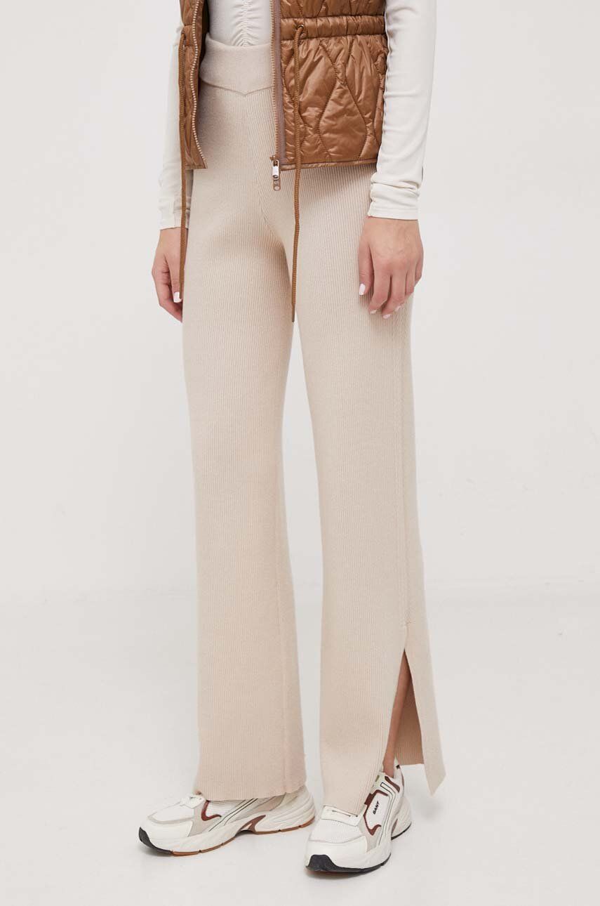 Kalhoty s příměsí vlny Calvin Klein béžová barva, široké, high waist - béžová - 48 % Bavlna