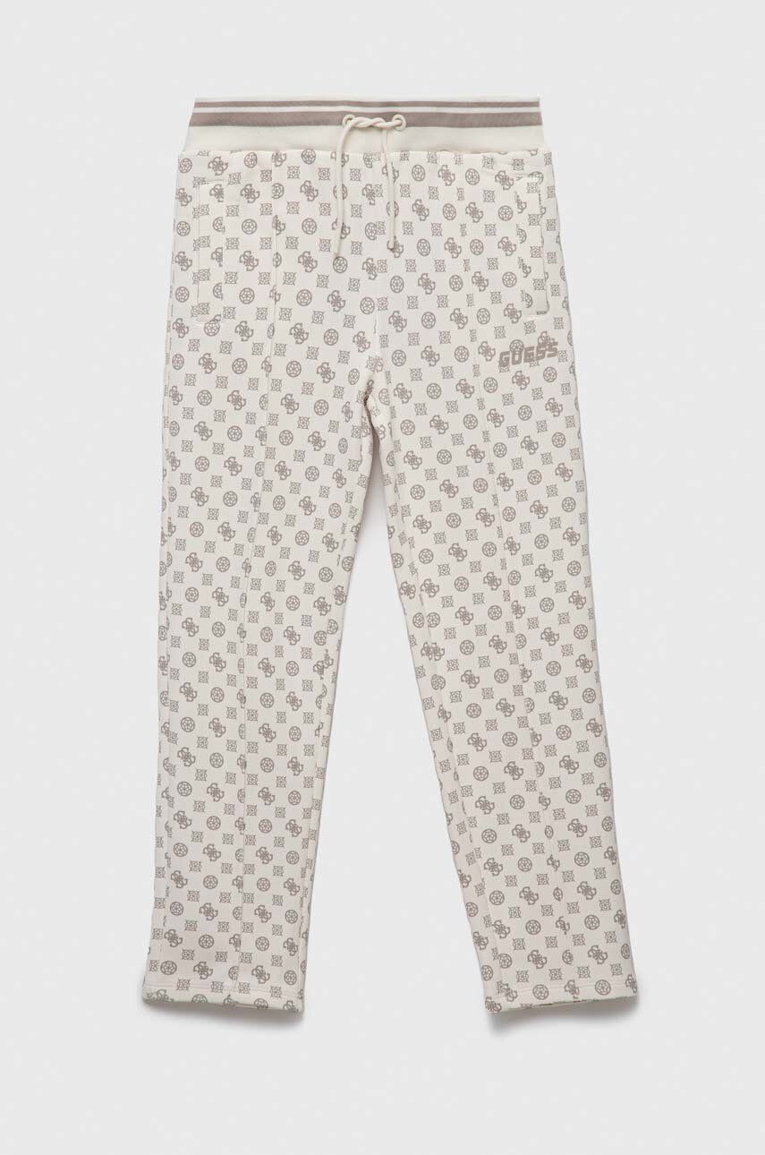 Dětské kalhoty Guess béžová barva, vzorované - béžová -  94 % Polyester