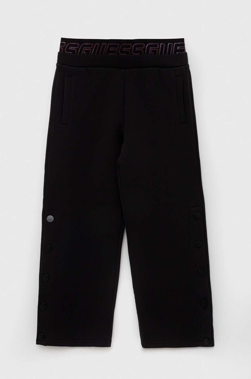 Levně Dětské tepláky Guess černá barva, hladké