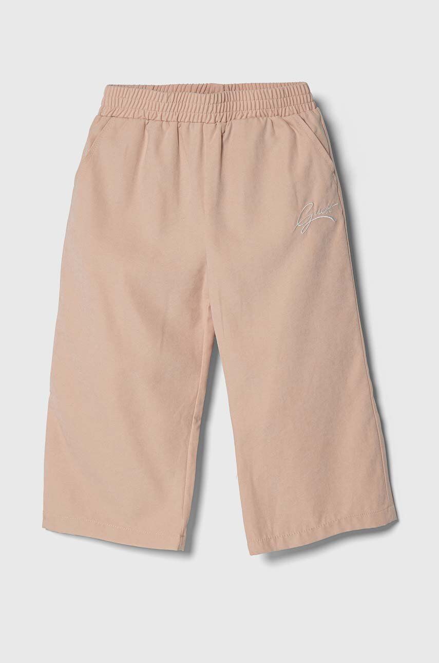 Levně Dětské kalhoty Guess růžová barva, hladké