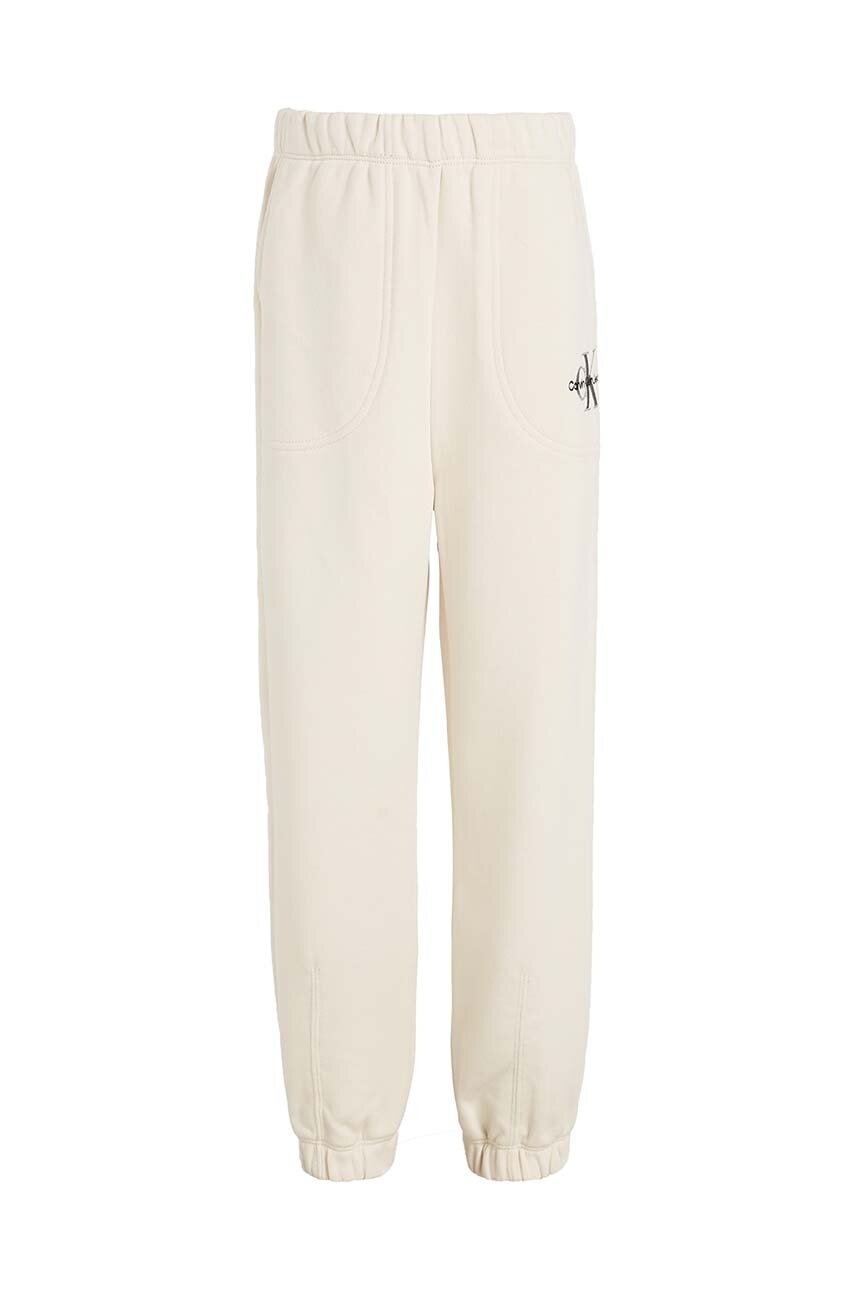 Детские спортивные штаны Calvin Klein Jeans цвет бежевый однотонные Детские спортивные штаны Calvin Klein Jeans цвет бежевый однотонные