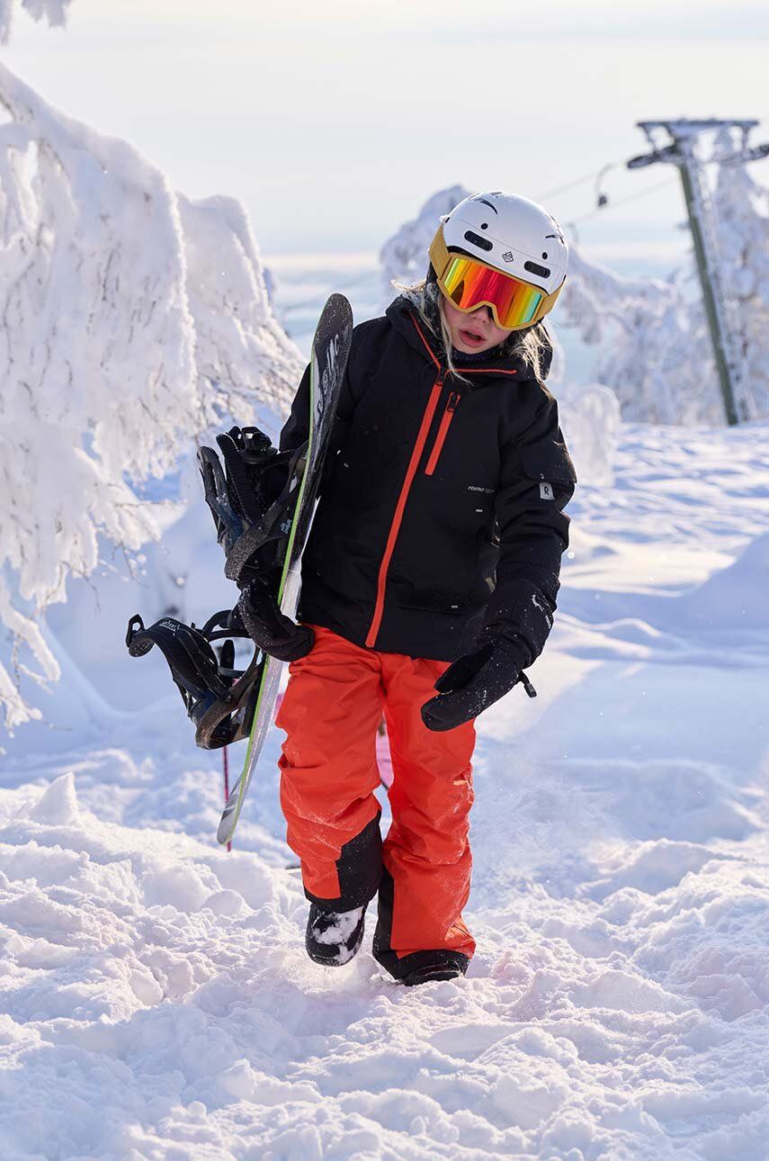 Levně Dětské lyžařské kalhoty Reima Wingon oranžová barva