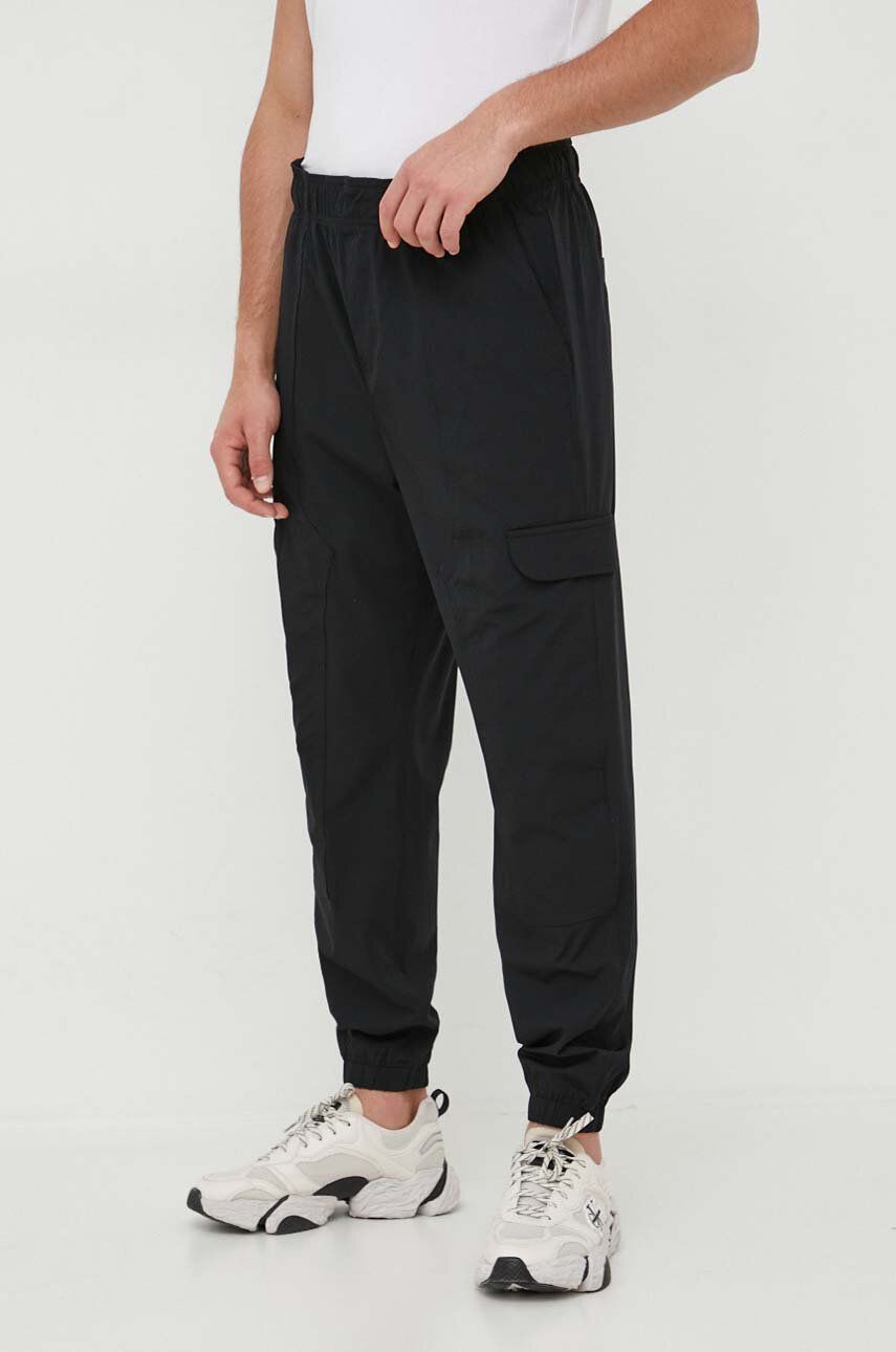 Tepláky Calvin Klein Jeans černá barva, hladké - černá -  85 % Polyamid