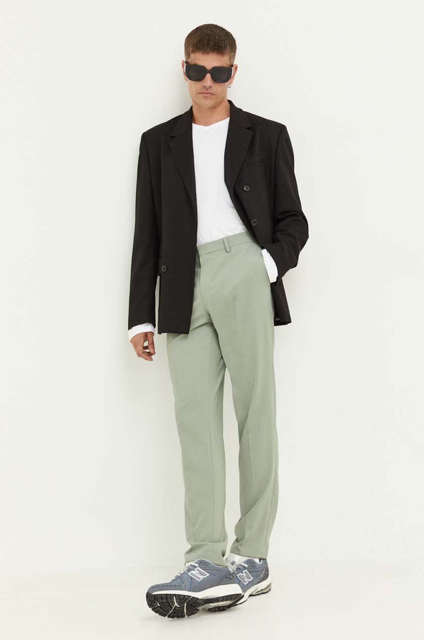 Kalhoty s příměsí vlny HUGO zelená barva, přiléhavé - zelená -  Hlavní materiál: 52 % Polyester