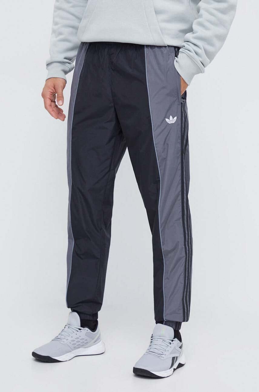 Levně Tepláky adidas Originals černá barva, vzorované