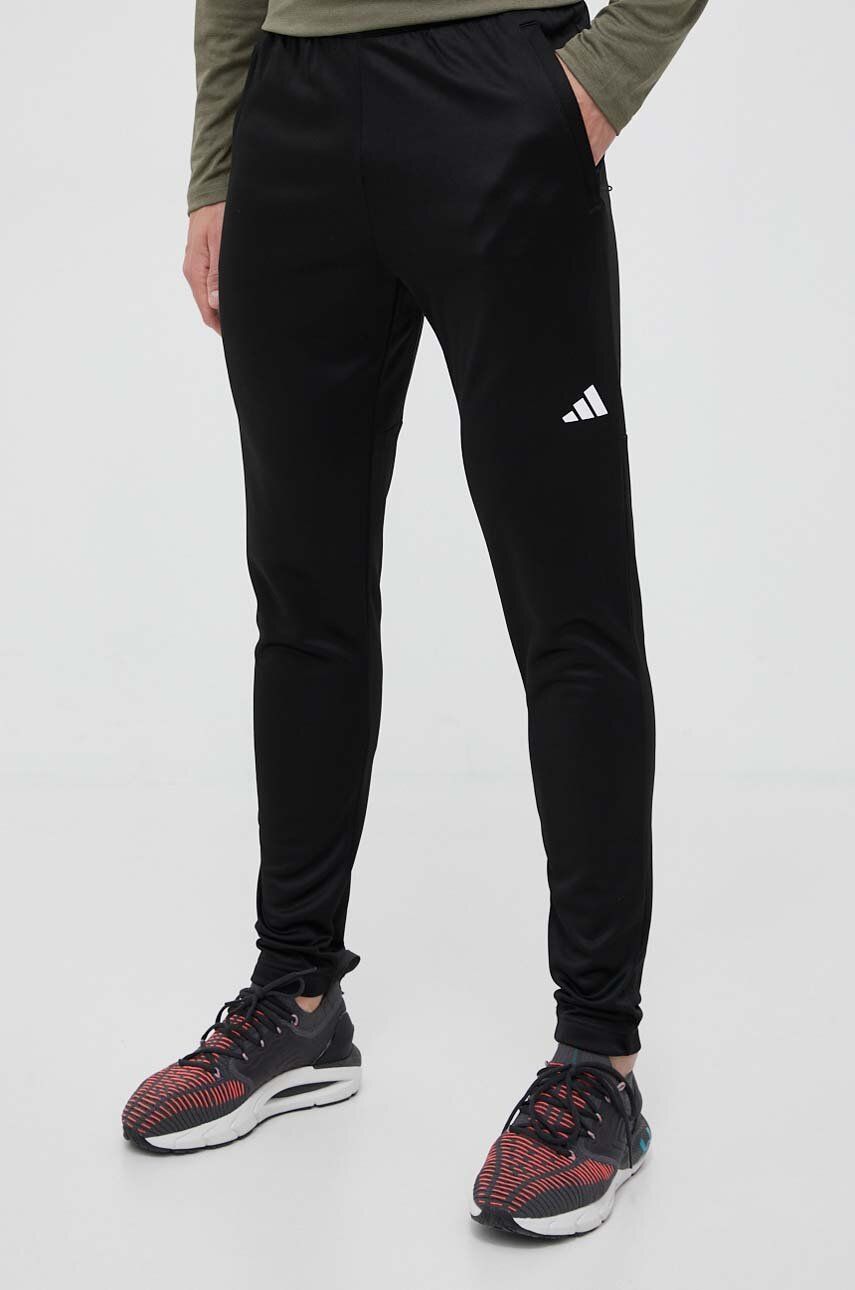 Levně Tréninkové kalhoty adidas Performance Train Essentials černá barva, hladké