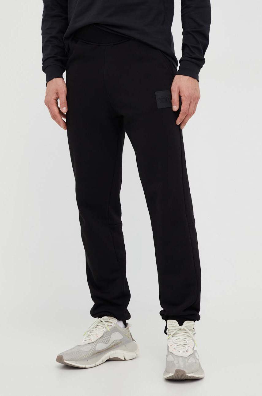 The North Face pantaloni de trening din bumbac culoarea negru, cu imprimeu