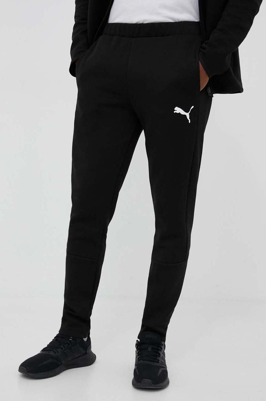 Levně Tréninkové kalhoty Puma EVOSTRIPE černá barva, s potiskem, 585814