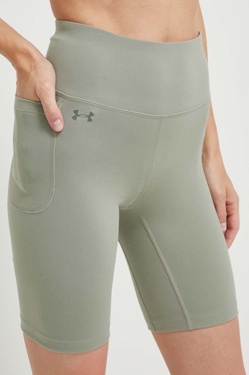 Levně Tréninkové šortky Under Armour Motion zelená barva, hladké, high waist