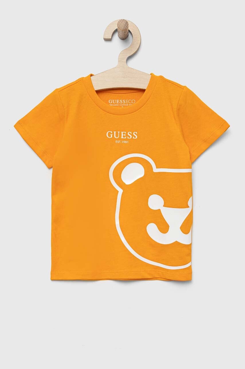 

Детская хлопковая футболка Guess цвет оранжевый с принтом