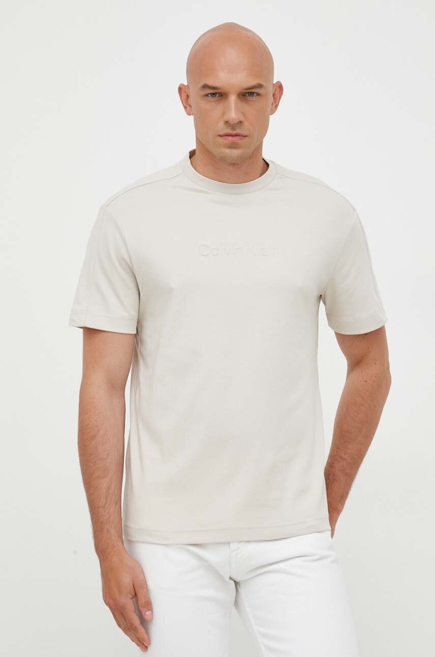 

Памучна тениска Calvin Klein в бежово с принт, Бежов