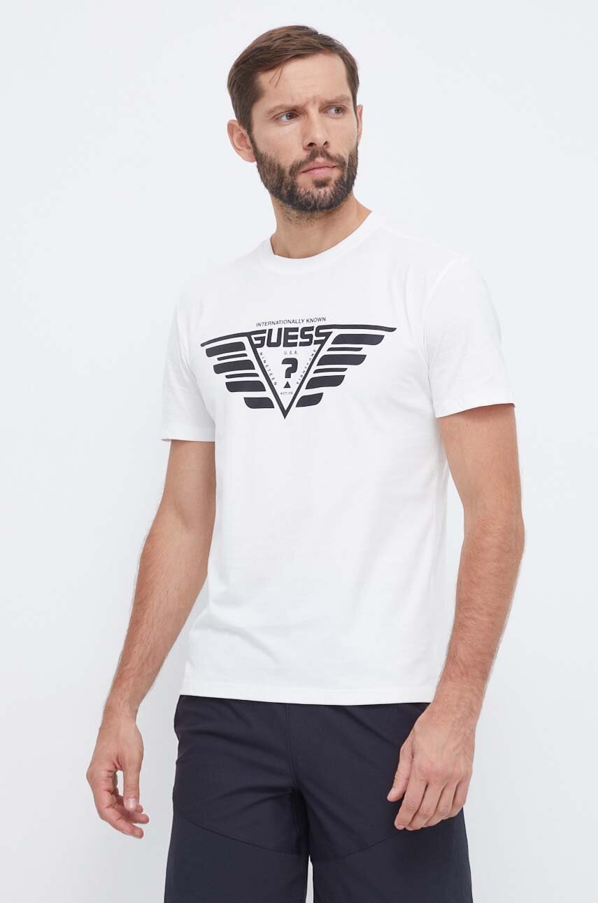 

Хлопковая футболка Guess цвет бежевый с принтом