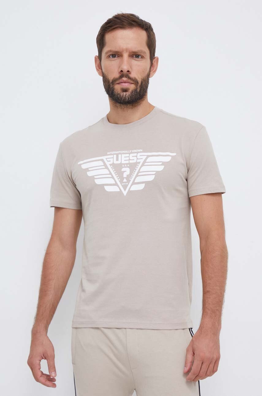 

Бавовняна футболка Guess колір бежевий з принтом