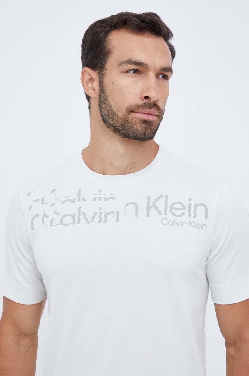 Levně Tréninkové tričko Calvin Klein Performance béžová barva, s potiskem