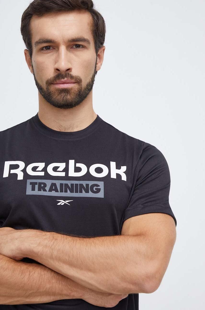 Levně Tréninkové tričko Reebok černá barva, s potiskem