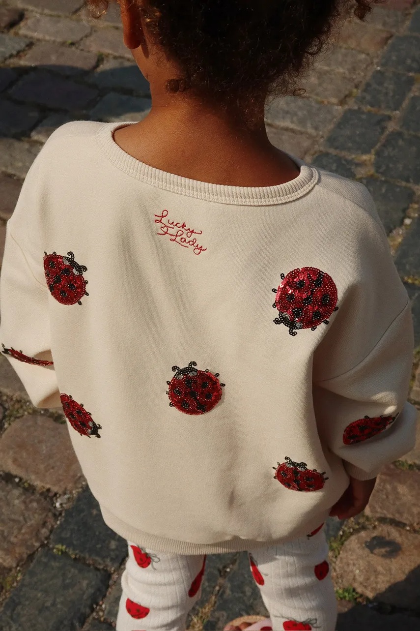 

Детски суичър Konges Sløjd LOU LADYBUG GLITTER SWEATSHIRT в бежово с апликация KS102204, Бежов
