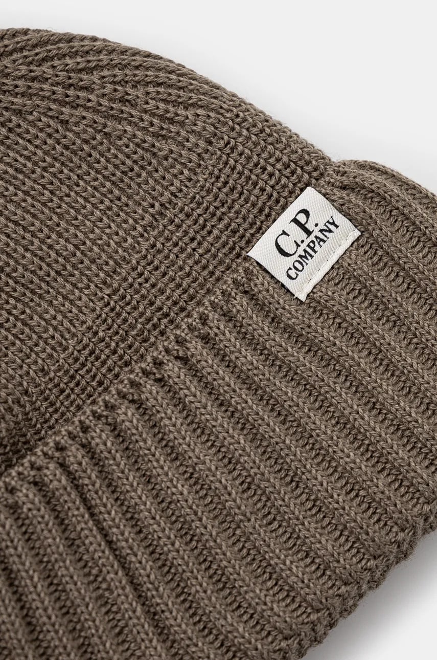 Шапка C.P. Company Knit Cap In Re-Wool цвет бежевый однотонная 17CMAC293A006595A Шапка C.P. Company Knit Cap In Re-Wool цвет бежевый однотонная 17CMAC293A006595A