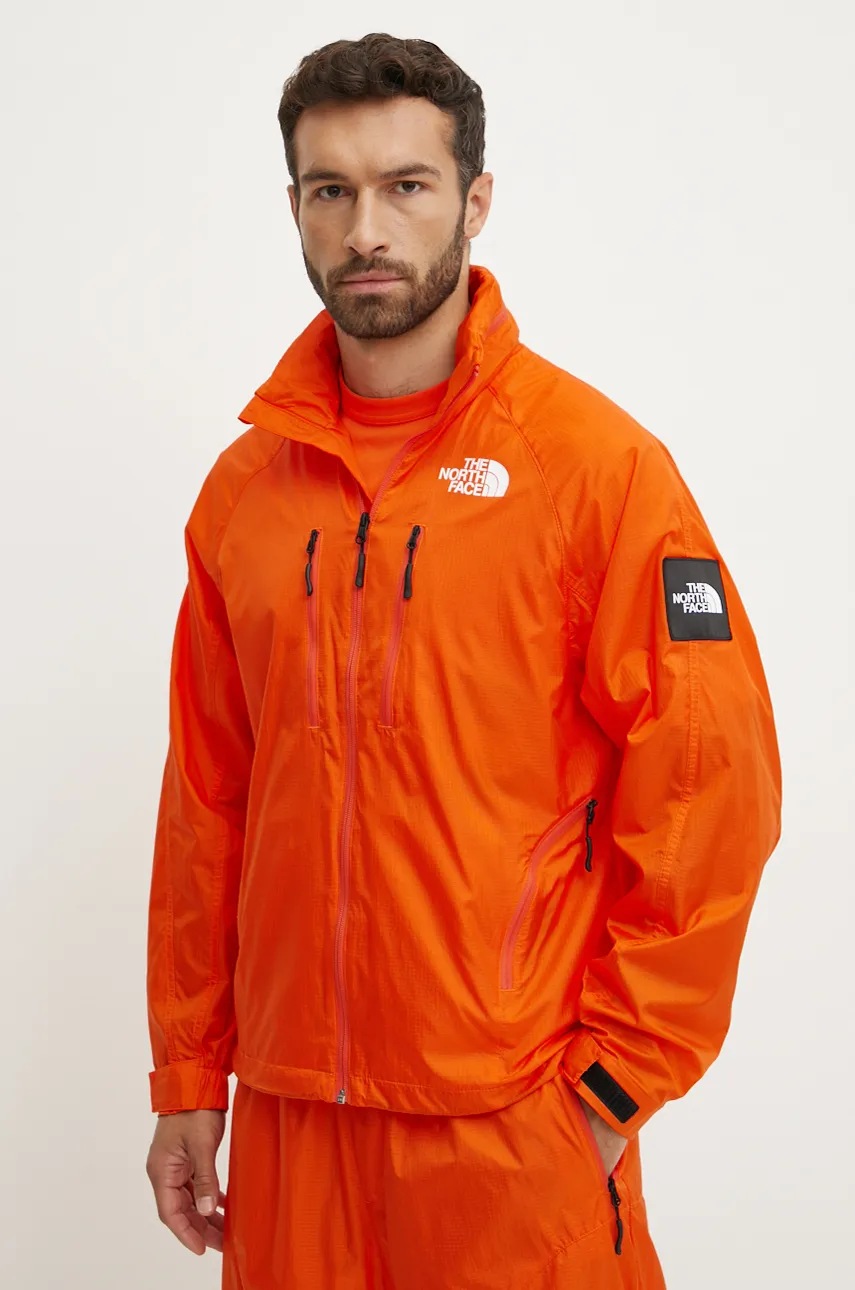 The North Face geacă TNF x Yinka Ilori culoarea portocaliu, de tranzitie, NF0A89GNA6M1