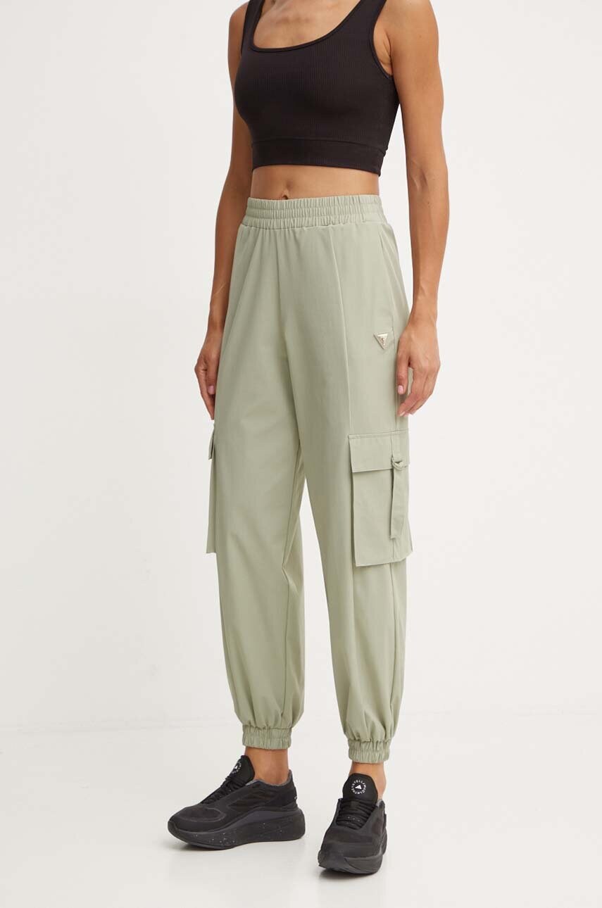 Levně Tepláky Guess AURLIE zelená barva, hladké, V4YB06 WG982