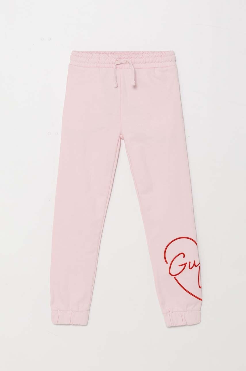 Levně Dětské bavlněné tepláky Guess růžová barva, s aplikací, J4YQ16 KA6R3