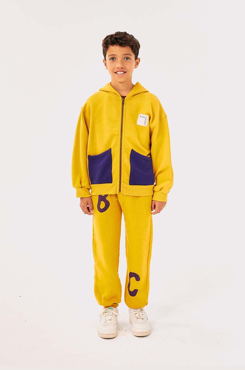 Bobo Choses pantaloni de trening din bumbac pentru copii culoarea galben, cu imprimeu, 224AC076 Bobo Choses pantaloni de trening din bumbac pentru copii culoarea galben, cu imprimeu, 224AC076