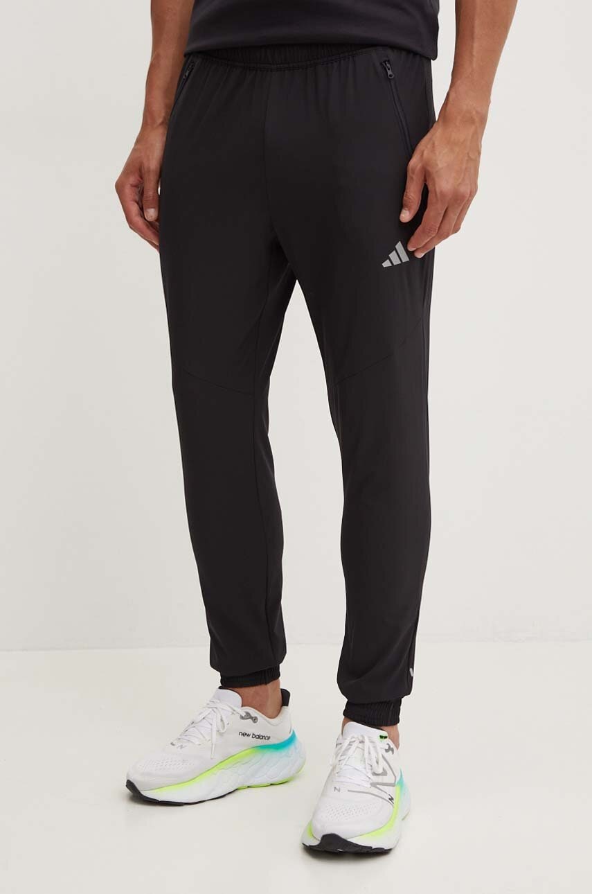 Levně Tepláky adidas černá barva, hladké, JD8733