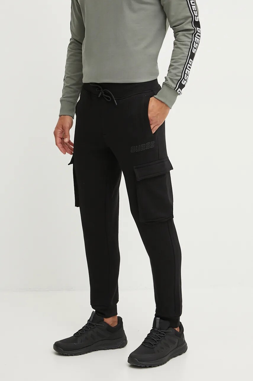 Levně Tepláky Guess ALDWIN černá barva, hladké, Z4YB08 K9V31