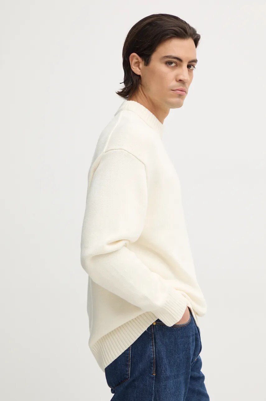 Levně Svetr z vlněné směsi Calvin Klein Jeans pánský, béžová barva, s pologolfem, J30J326195