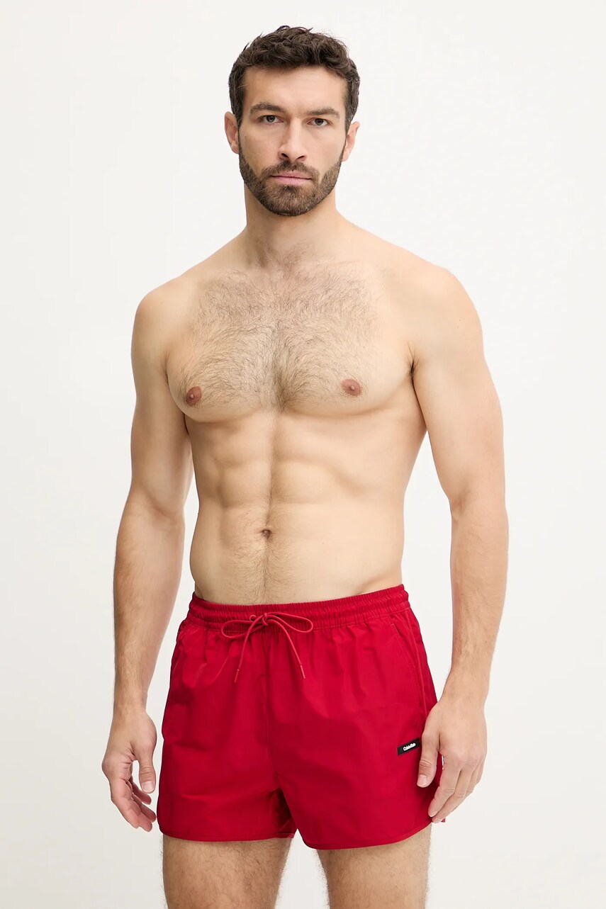 Levně Plavkové šortky Calvin Klein červená barva, LV00N61110