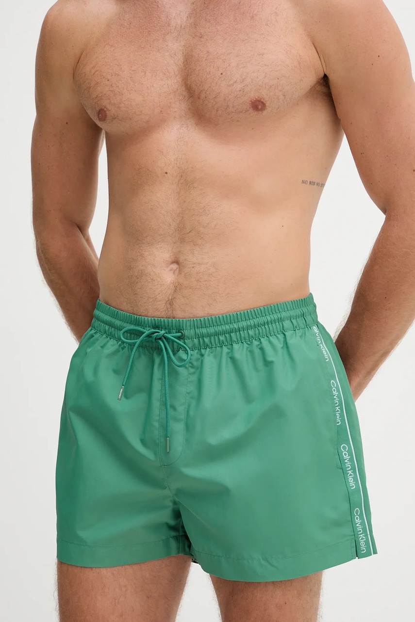 Levně Plavkové šortky Calvin Klein zelená barva, LV00N61108